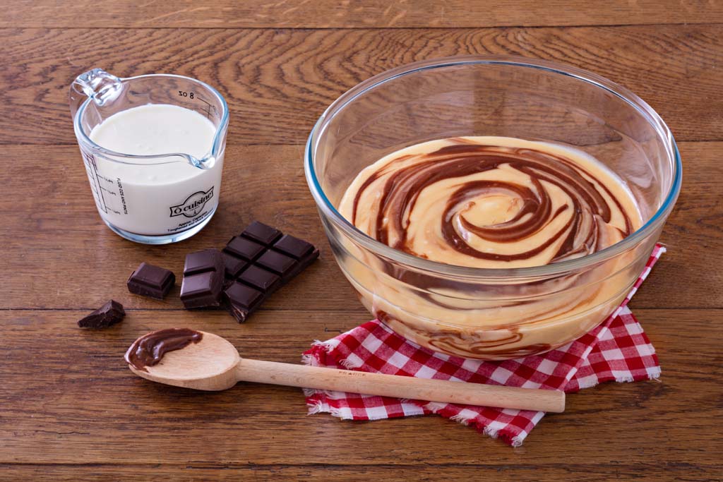 Preparing chocolate cake in an ÔCuisine gass measuring jug and Mixing bowl