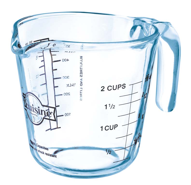 Clear ÔCuisine measuring cup with  measurement markings on a white background